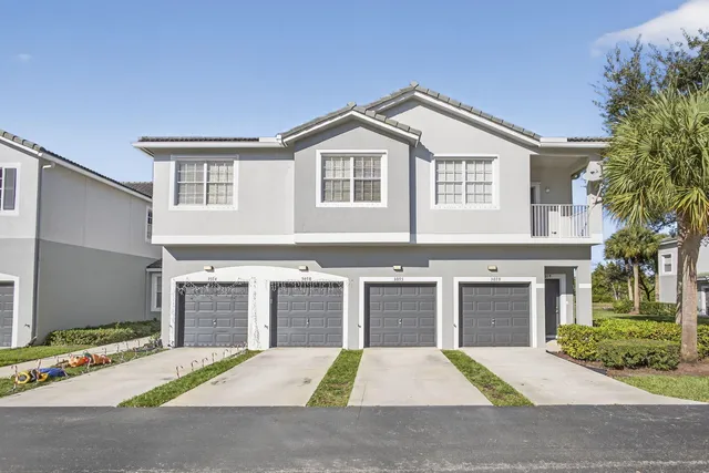 a front view of a house with yard