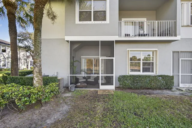 a view of backyard patio and outdoor seating