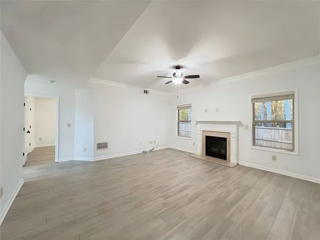 a kitchen with stainless steel appliances kitchen island granite countertop a stove a sink and a microwave