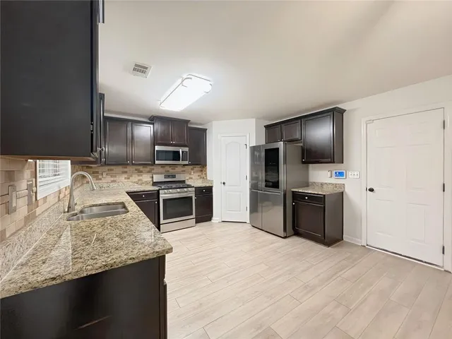 a view of a hallway with entryway