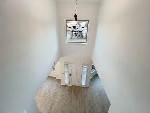 a spacious bathroom with a double vanity sink a mirror and a bathtub