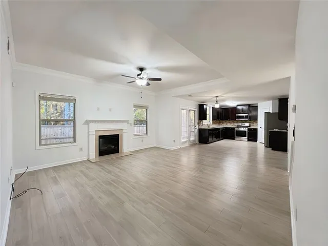 a view of empty room with fireplace