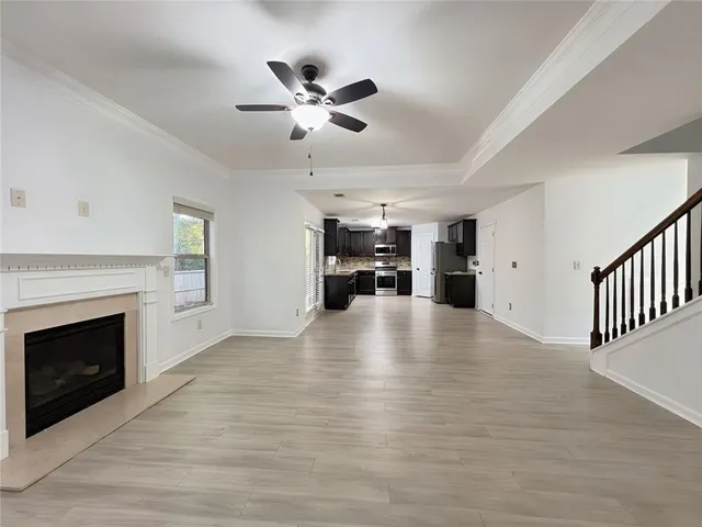 wooden floor fireplace and windows in a room