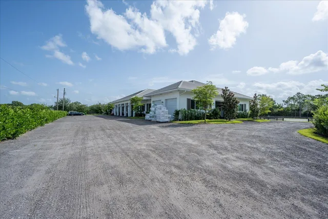 a view of house with yard and green space