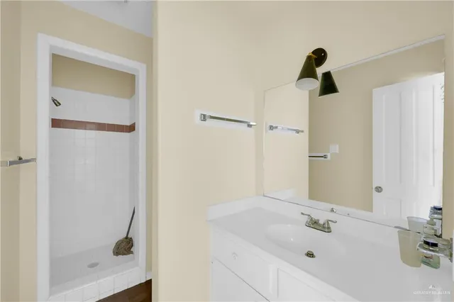 a bathroom with a tub and a sink