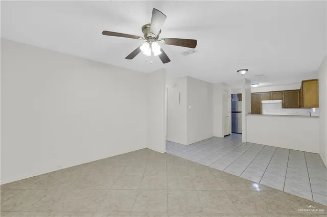 a view of a kitchen with a sink and cabinet area