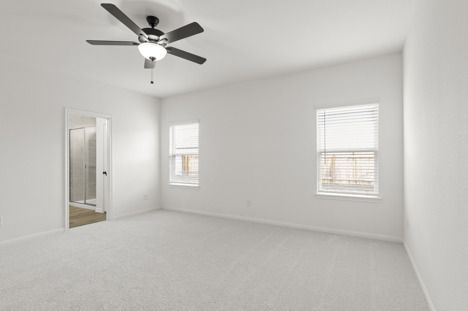 3717 Pin Oak Hills Seguin, TX 78155 - Photo 11 of 22 an empty room with a window and a fan