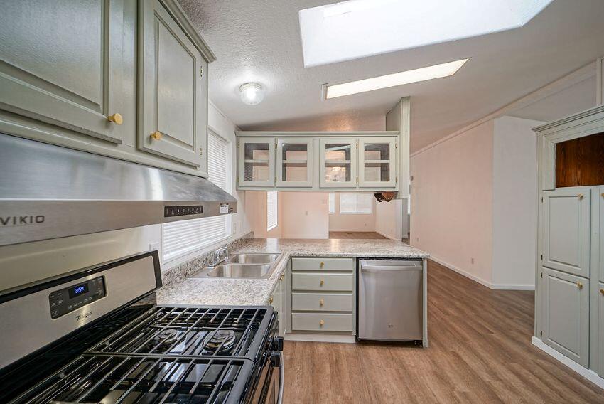 1291 Red Hill Road Junction City, CA 96048 - Photo 13 of 24 a kitchen with a stove a refrigerator and wooden floor