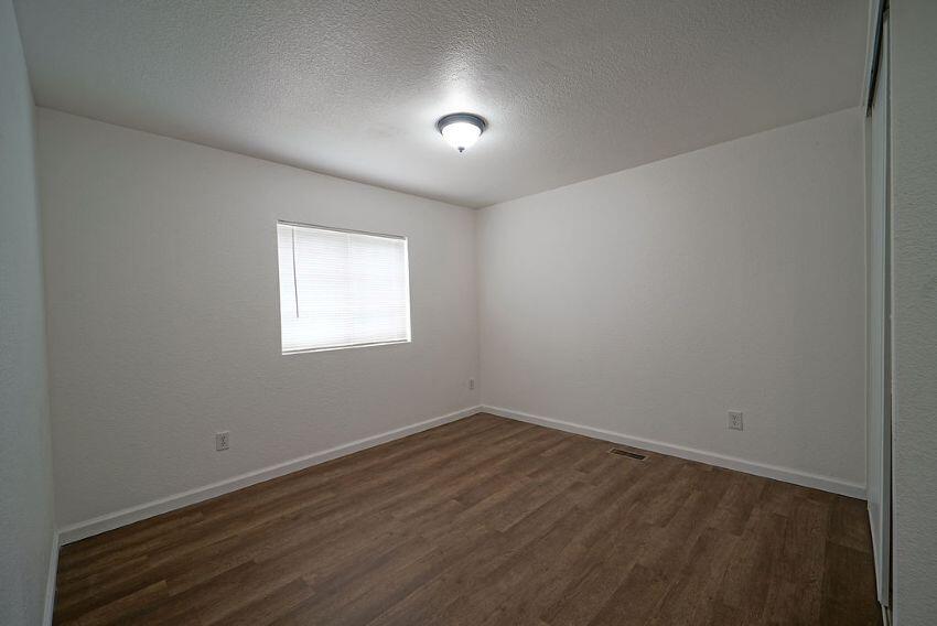 1291 Red Hill Road Junction City, CA 96048 - Photo 17 of 24 an empty room with wooden floor and windows