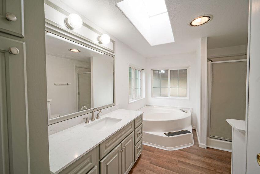 1291 Red Hill Road Junction City, CA 96048 - Photo 22 of 24 a bathroom with a double vanity sink a mirror and a shower