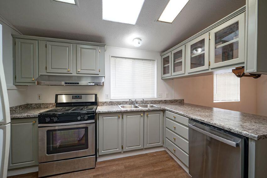 1291 Red Hill Road Junction City, CA 96048 - Photo 6 of 24 a kitchen with granite countertop cabinets stainless steel appliances and a sink
