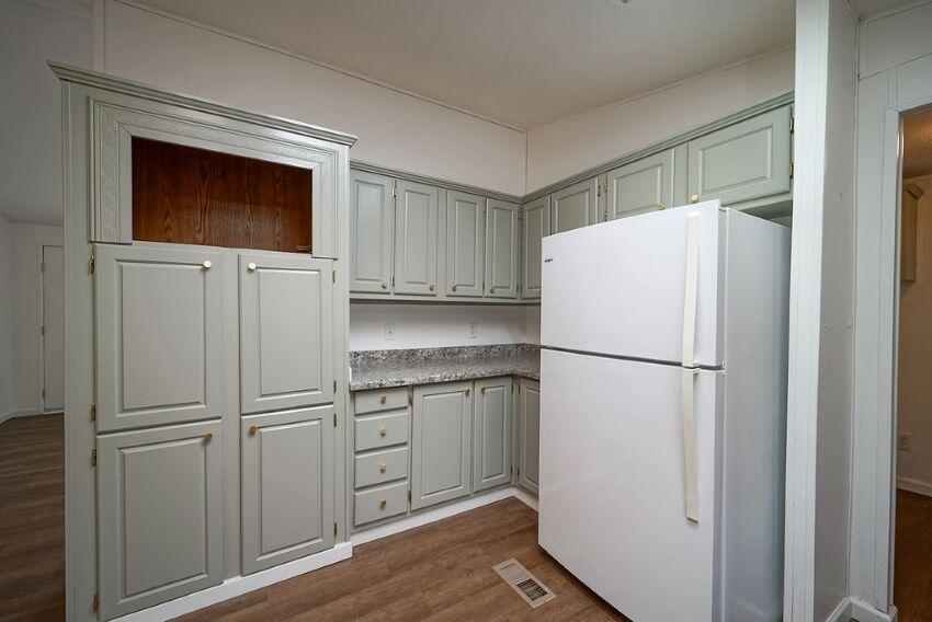 1291 Red Hill Road Junction City, CA 96048 - Photo 7 of 24 a white refrigerator freezer and a stove sitting inside of a kitchen