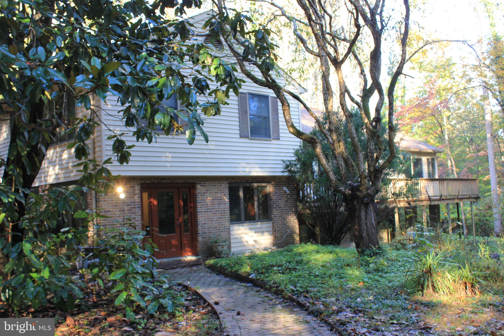 5510 Stephen Reid Road Huntingtown, MD 20639 - Photo 1 of 59 a house view with a garden space