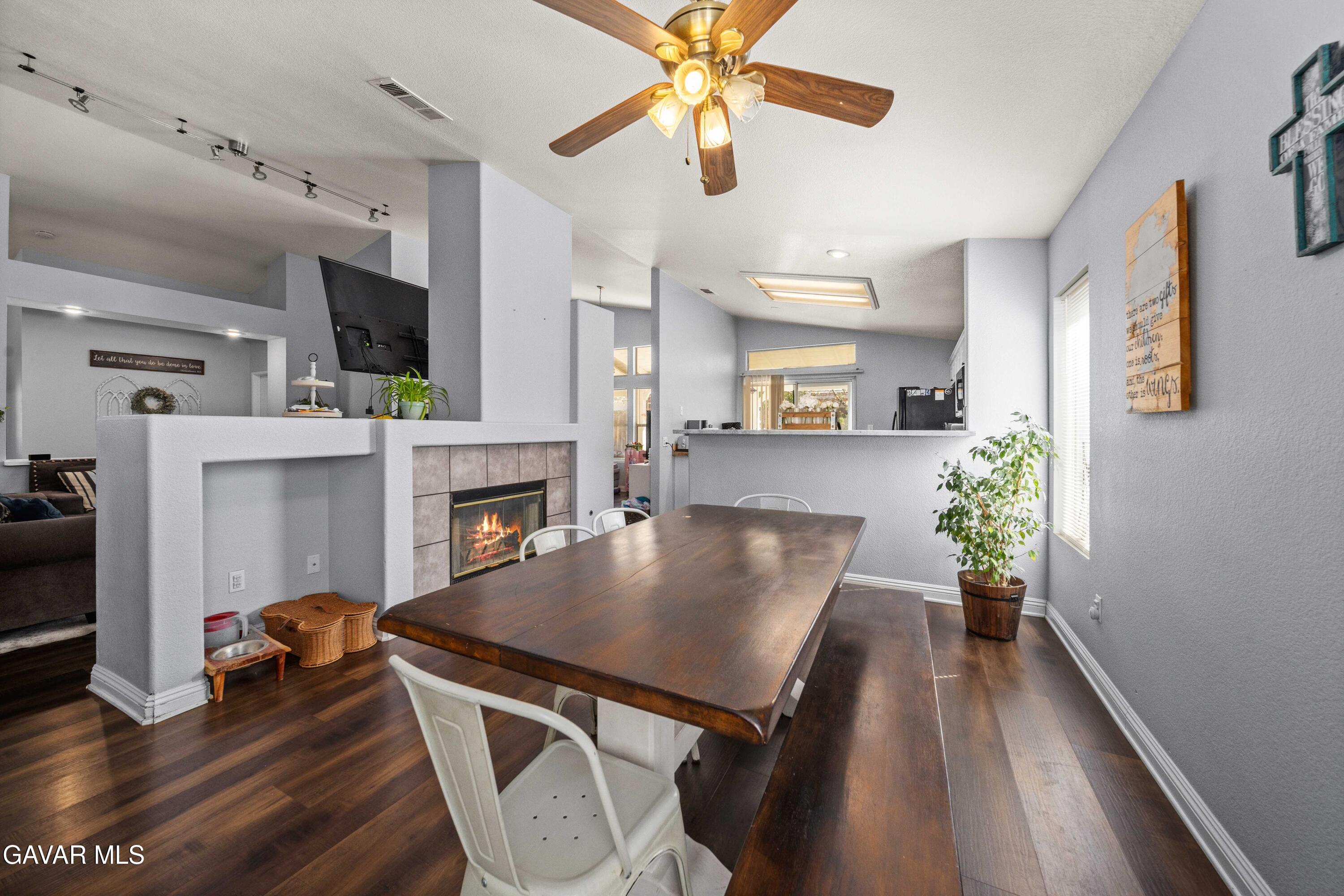 45736 Victoria Avenue Lancaster, CA 93534 - Photo 16 of 30 a living room with furniture and a wooden floor