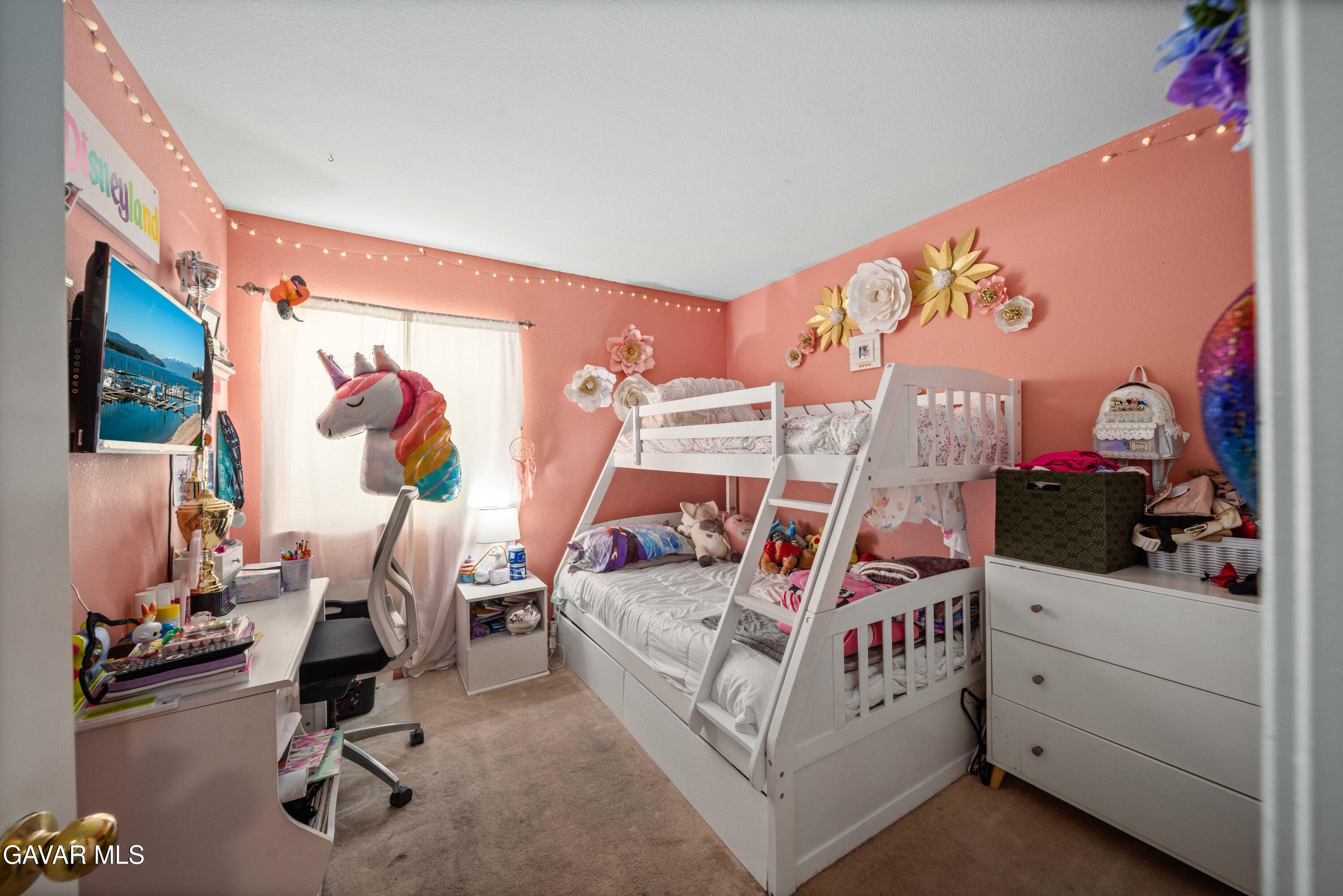 45736 Victoria Avenue Lancaster, CA 93534 - Photo 22 of 30 a bedroom with furniture and a flat screen tv