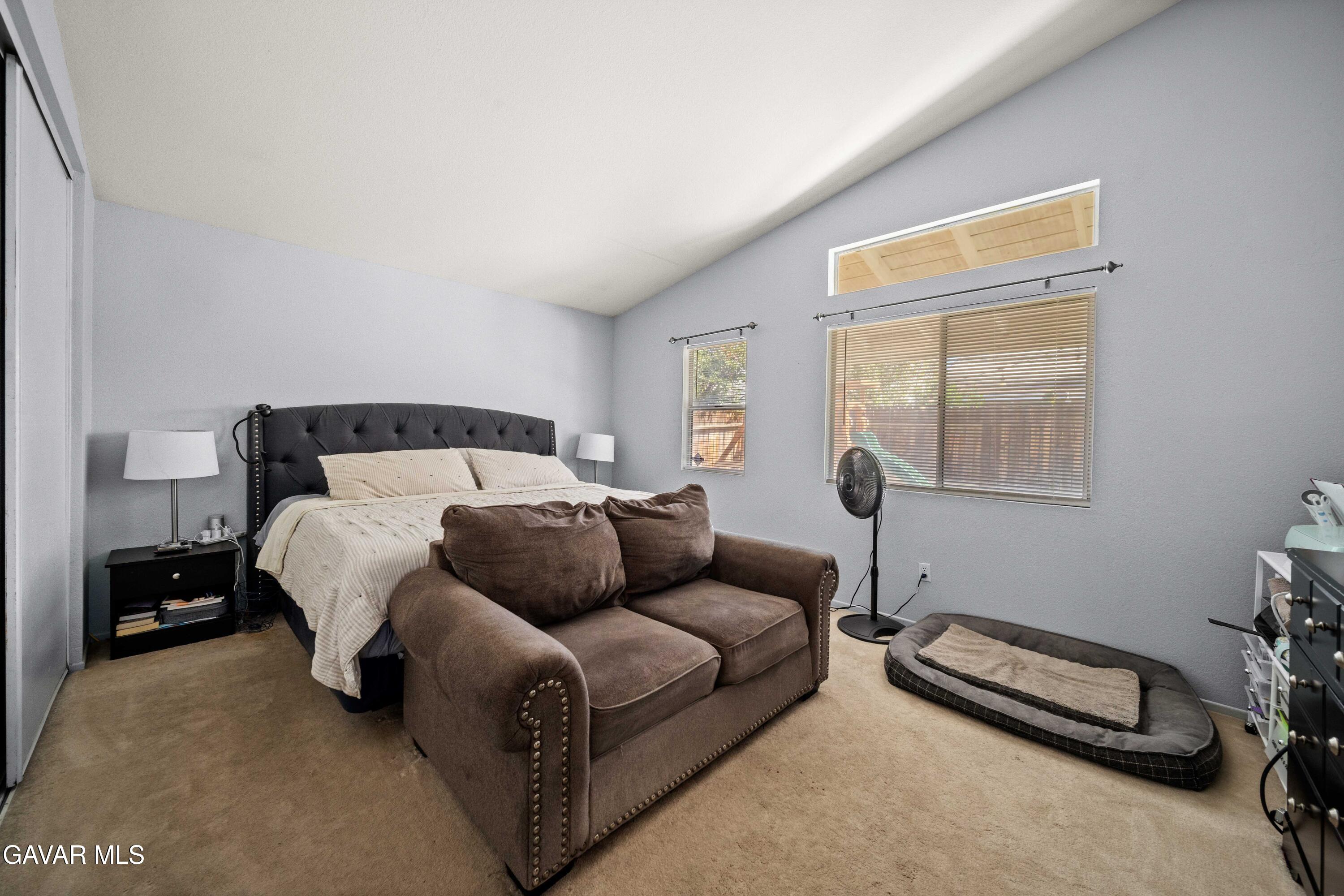 45736 Victoria Avenue Lancaster, CA 93534 - Photo 23 of 30 a bedroom with a bed and a window