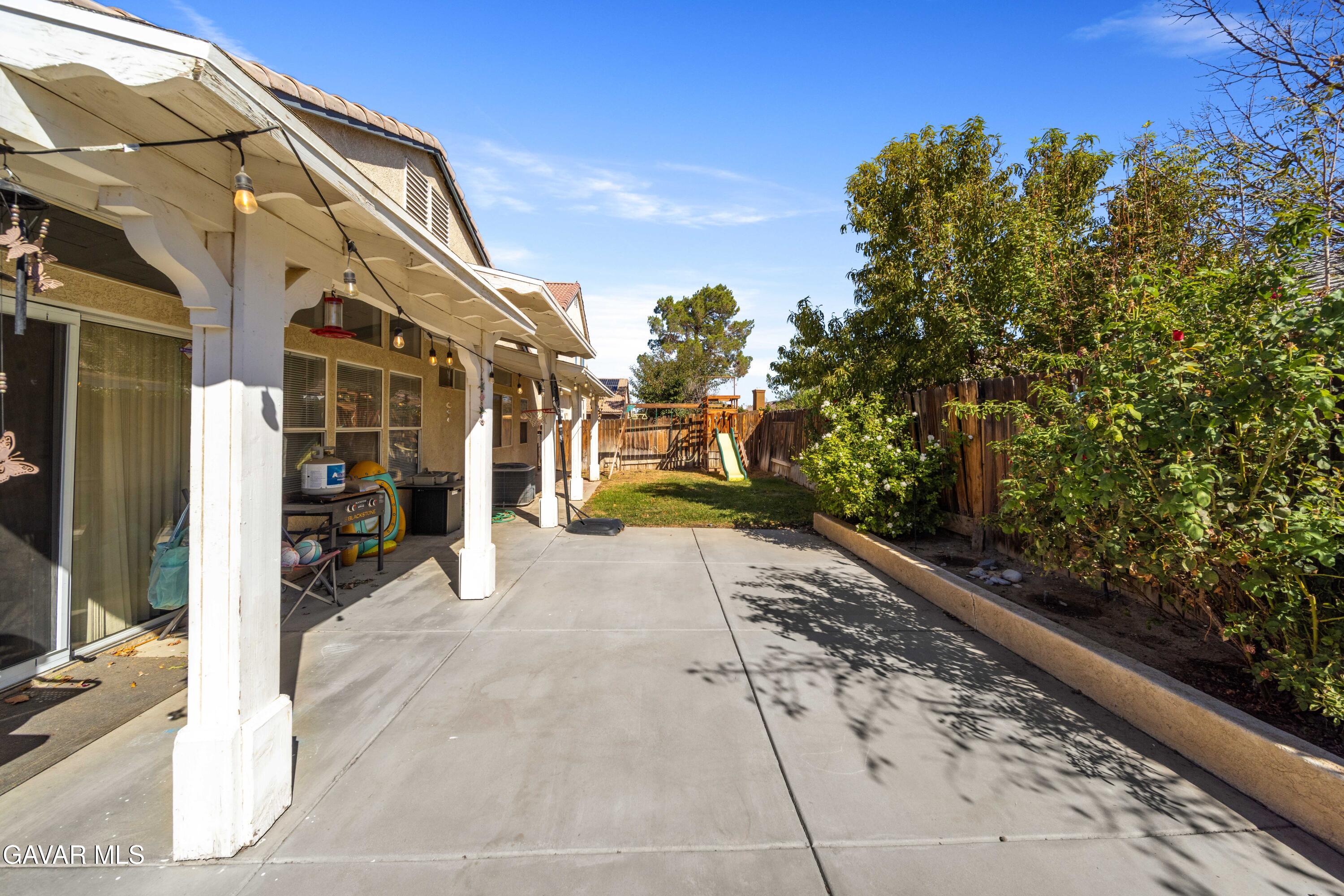 45736 Victoria Avenue Lancaster, CA 93534 - Photo 27 of 30 a view of a pathway with a building in the background