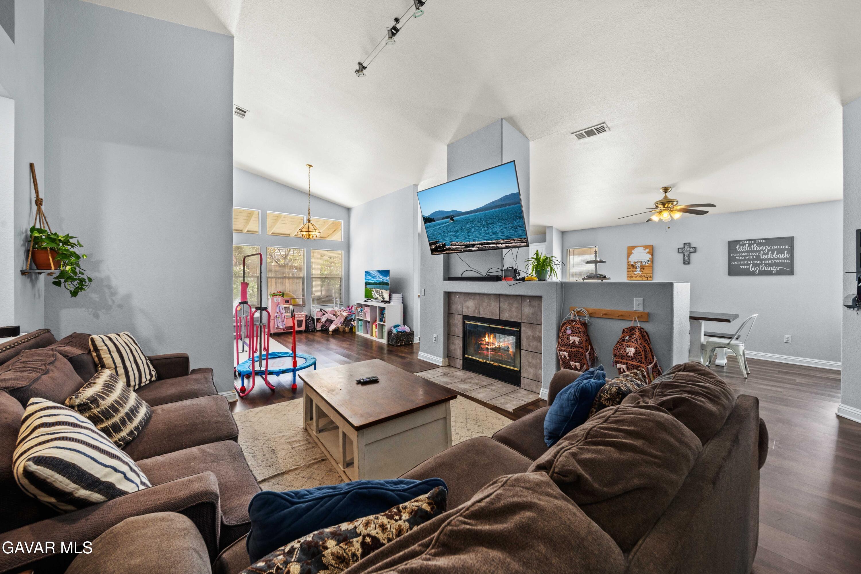 45736 Victoria Avenue Lancaster, CA 93534 - Photo 3 of 30 a living room with furniture fireplace and a window