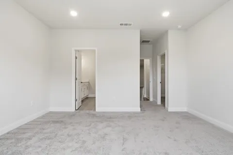 a bathroom with a double vanity sink a shower and a mirror