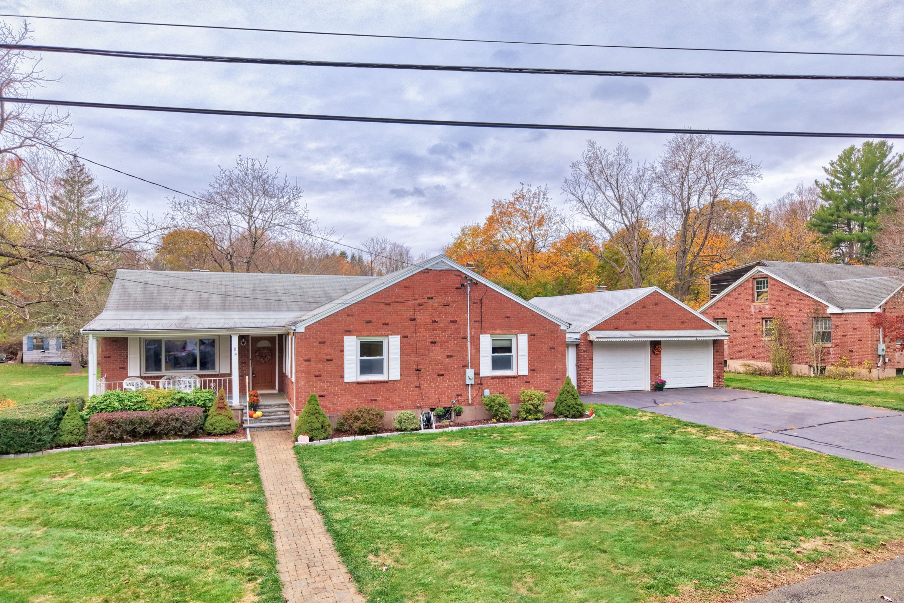 9 Sunset Drive Middlefield, CT 06481 - Photo 1 of 40 a front view of a house with a yard and garage