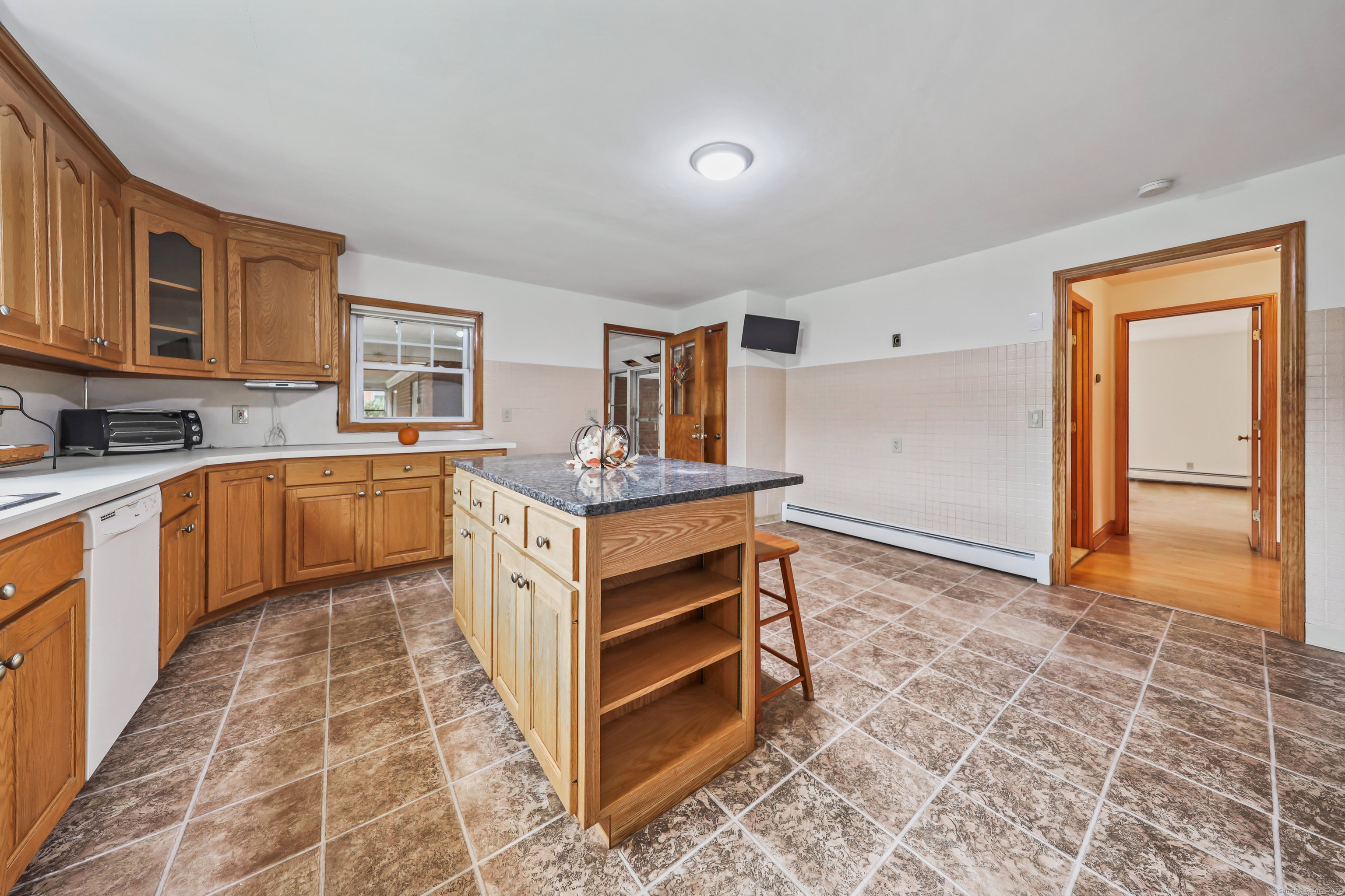 9 Sunset Drive Middlefield, CT 06481 - Photo 11 of 40 a kitchen with a stove sink and cabinets
