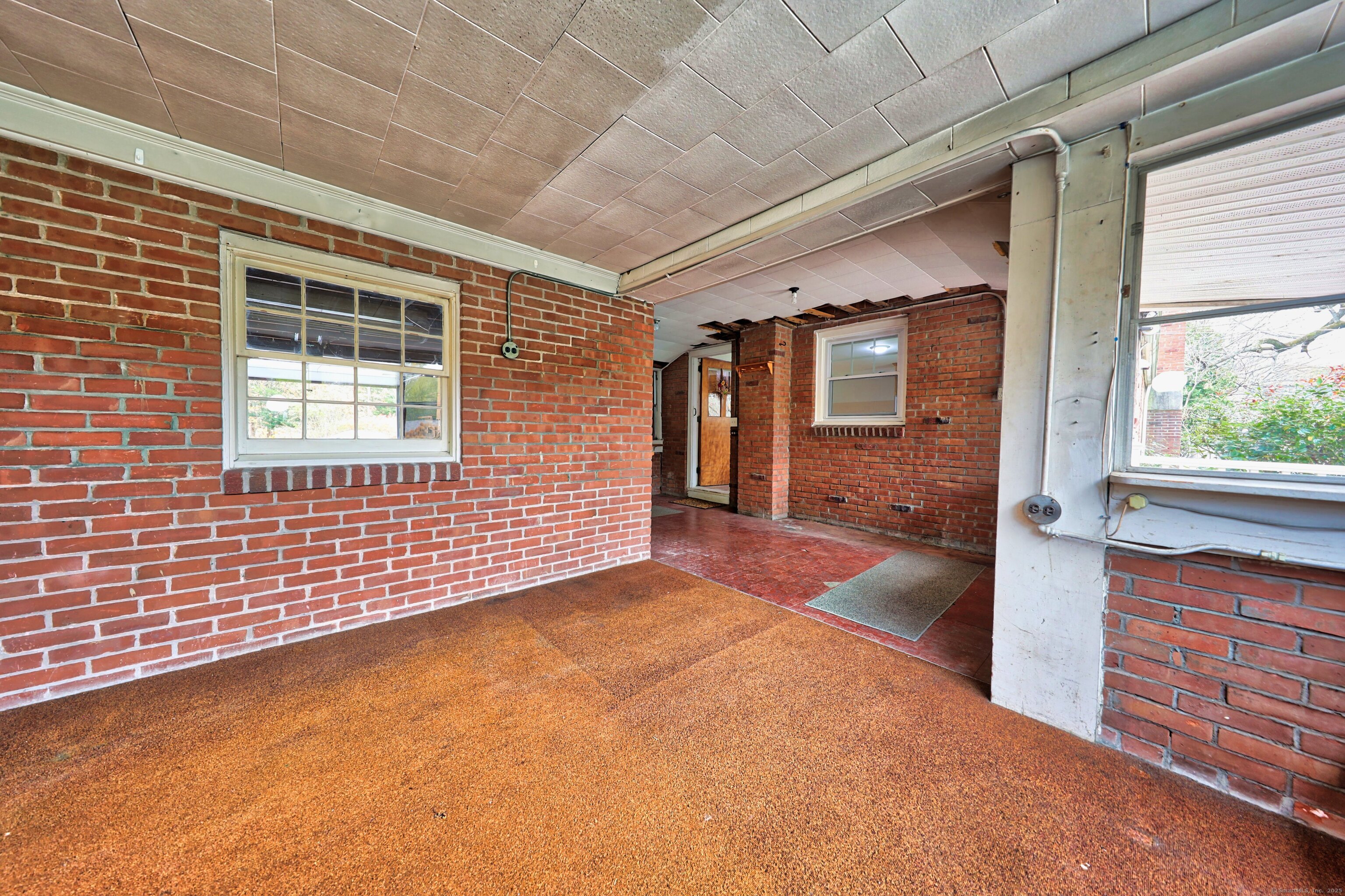 9 Sunset Drive Middlefield, CT 06481 - Photo 30 of 40 a view of an empty room with a fireplace and a window