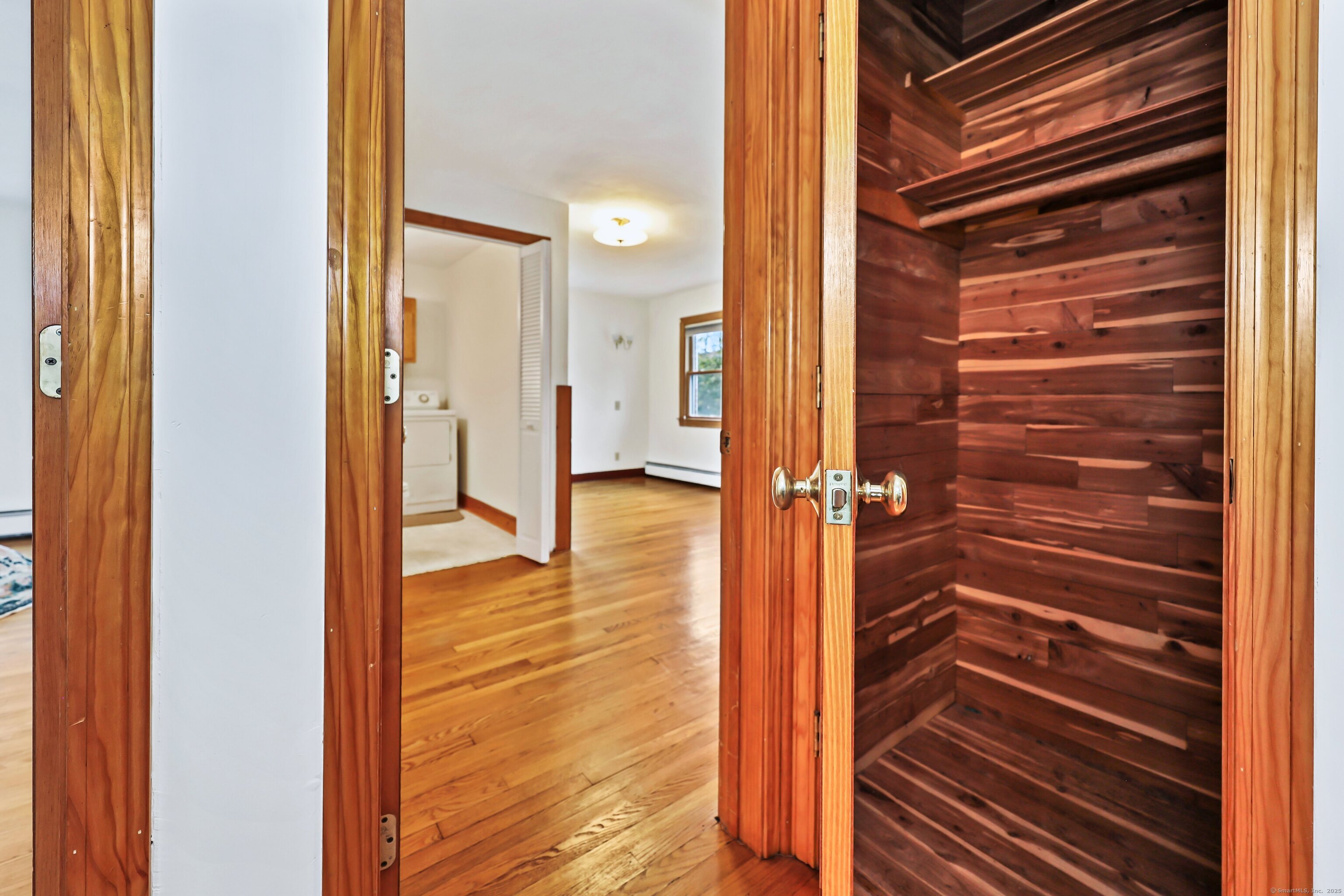 9 Sunset Drive Middlefield, CT 06481 - Photo 33 of 40 a view of closet area with wooden floor