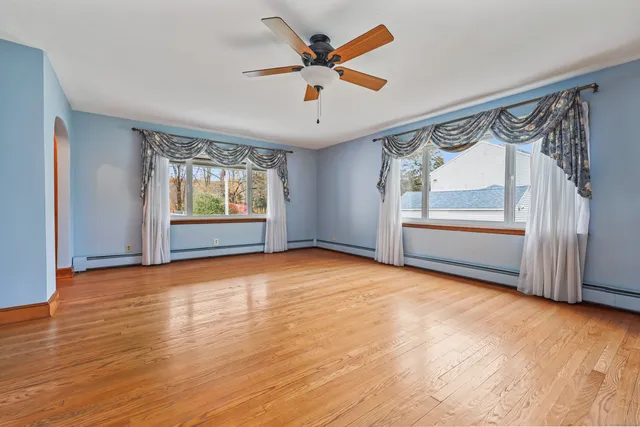 a view of an empty room with a window