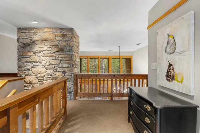 a living room with furniture a fireplace and a table