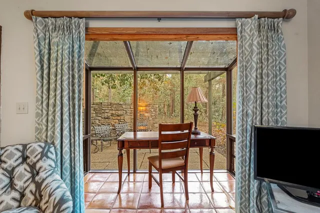 a bathroom with a glass shower door