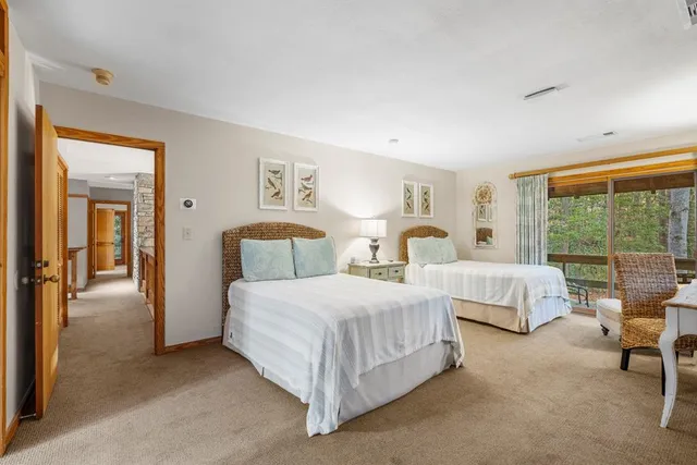 a bedroom with a bed and a walk in closet