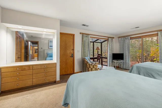 an aerial view of a house with outdoor space and sitting area