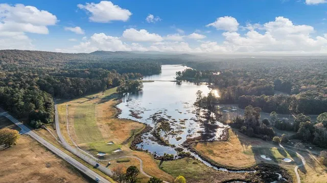 a view of swimming pool with a sitting area