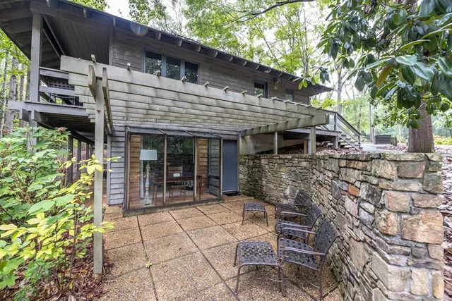 a view of house with outdoor seating