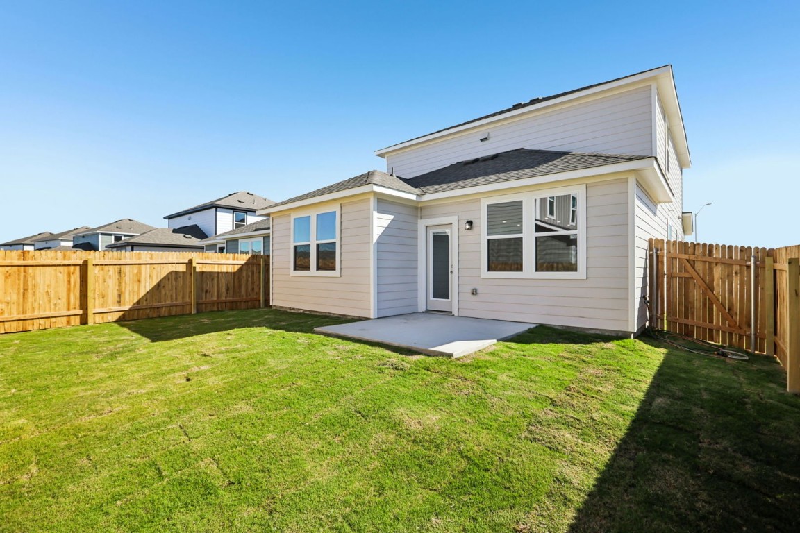 148 Cutleaf San Marcos, TX 78666 - Photo 14 of 34 a backyard of a house with yard and garage