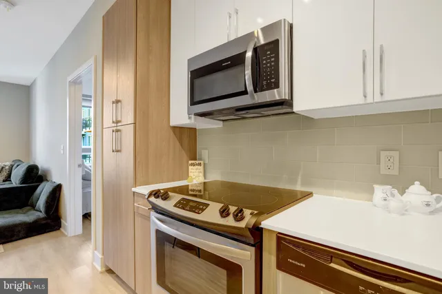a kitchen with a stove and a microwave