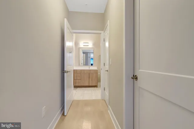 a view of a bathroom from the hallway