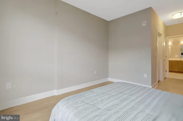 a view of a room with wooden floor