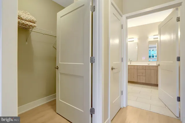 view of a bathroom with a shower and a sink