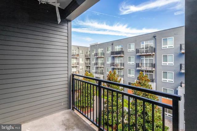 a view of a balcony with furniture