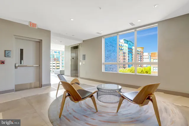 a dining room with furniture and a window