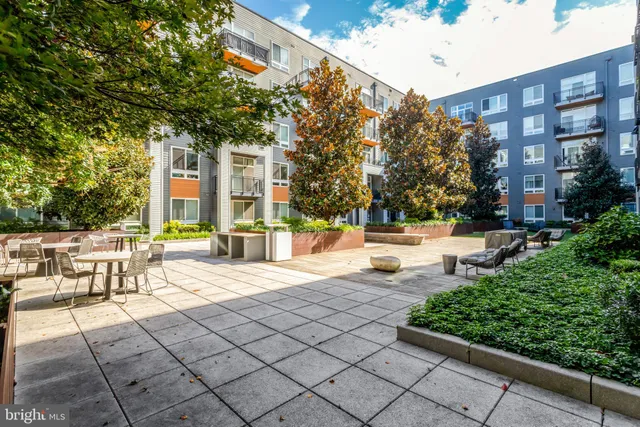 a view of a building with sitting area