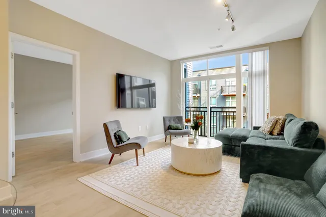 a living room with furniture and a large window