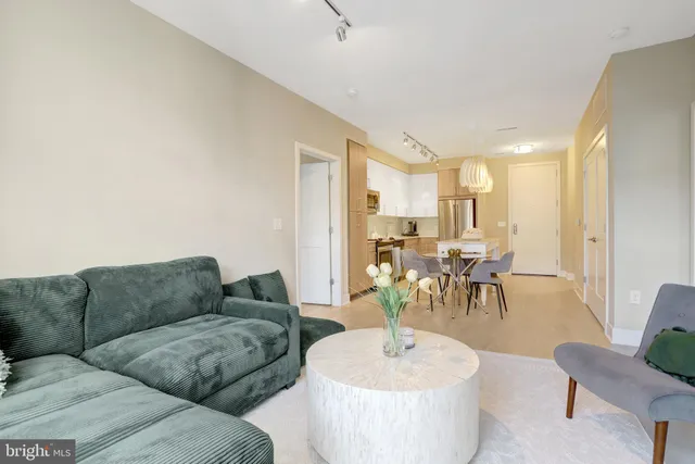 a living room with furniture and a table