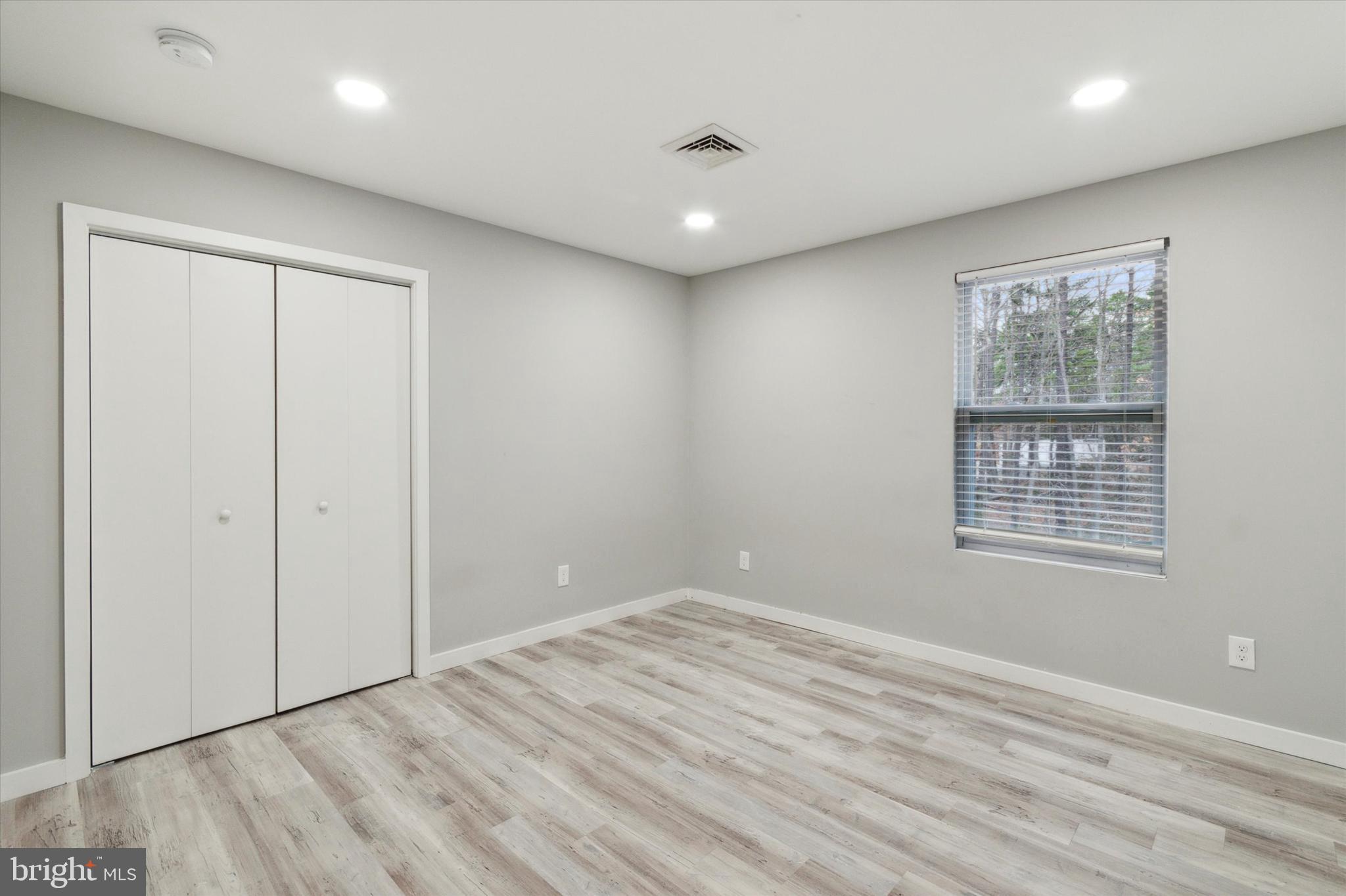 113 Kresson Gibbsboro Road, Unit 2 Voorhees, NJ 08043 - Photo 11 of 25 a view of an empty room with wooden floor and a window