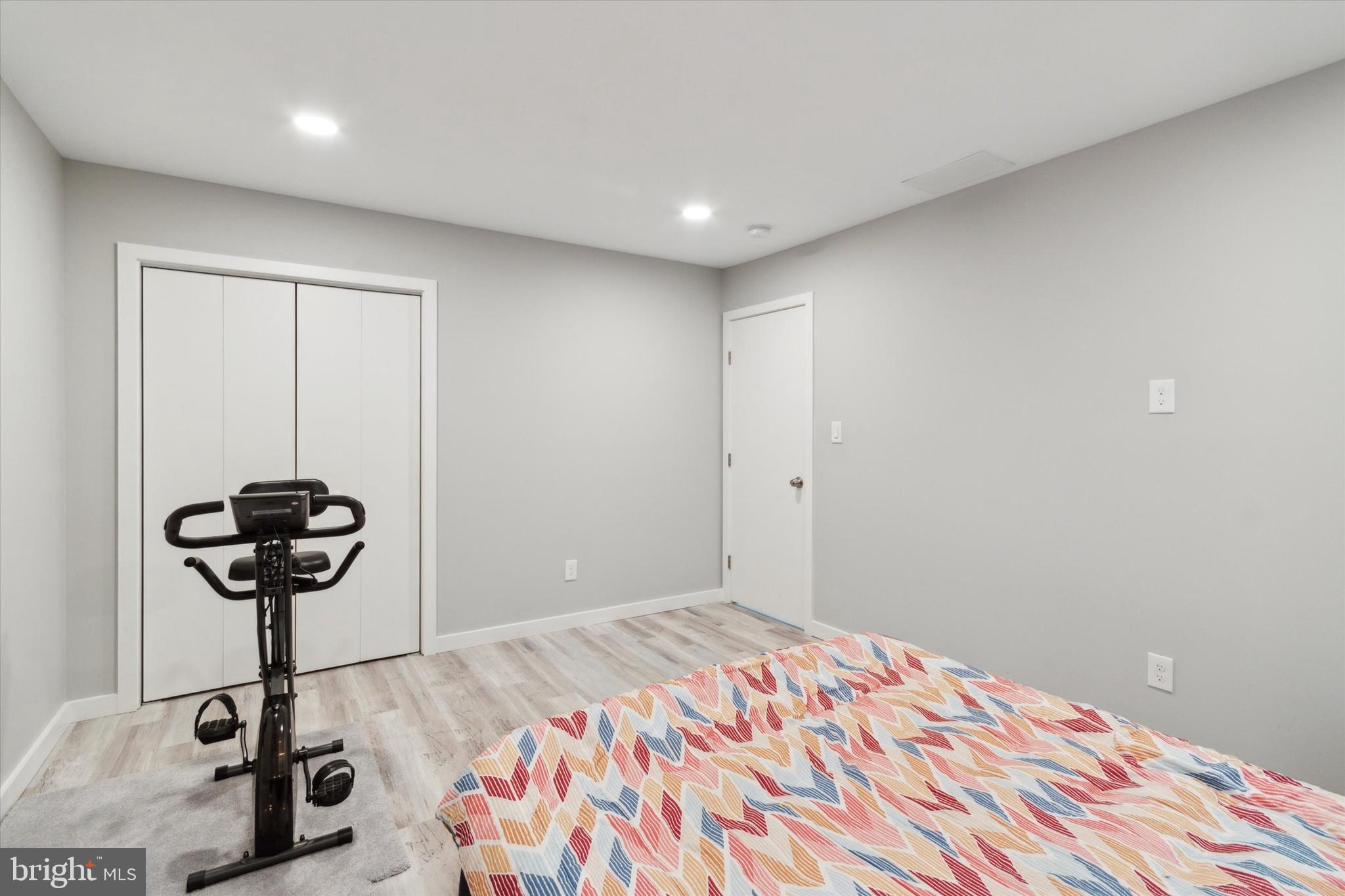 113 Kresson Gibbsboro Road, Unit 2 Voorhees, NJ 08043 - Photo 15 of 25 a room with a bed and a chandelier