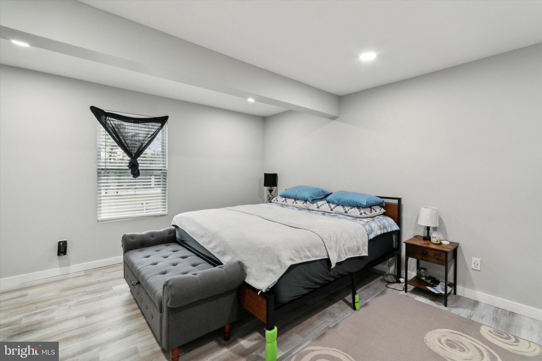 113 Kresson Gibbsboro Road, Unit 2 Voorhees, NJ 08043 - Photo 17 of 25 a bedroom with a bed window and table