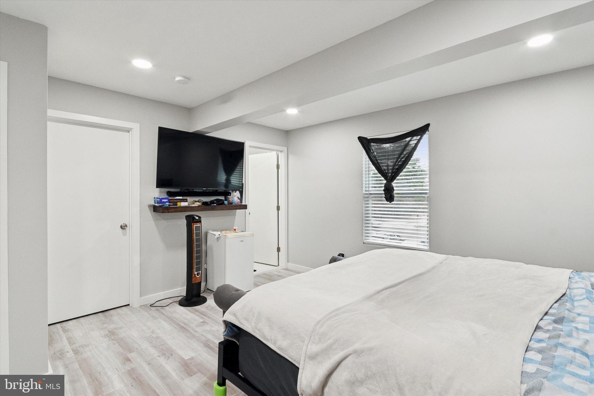 113 Kresson Gibbsboro Road, Unit 2 Voorhees, NJ 08043 - Photo 18 of 25 a bedroom with a bed and a flat screen tv