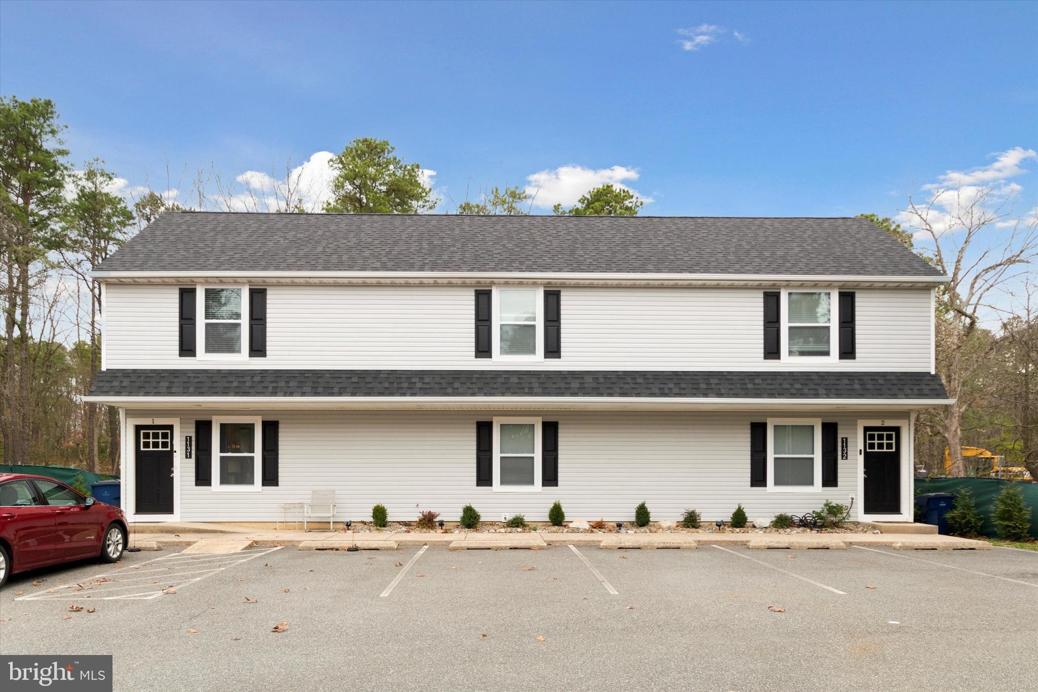 113 Kresson Gibbsboro Road, Unit 2 Voorhees, NJ 08043 - Photo 2 of 25 a front view of a house with a yard