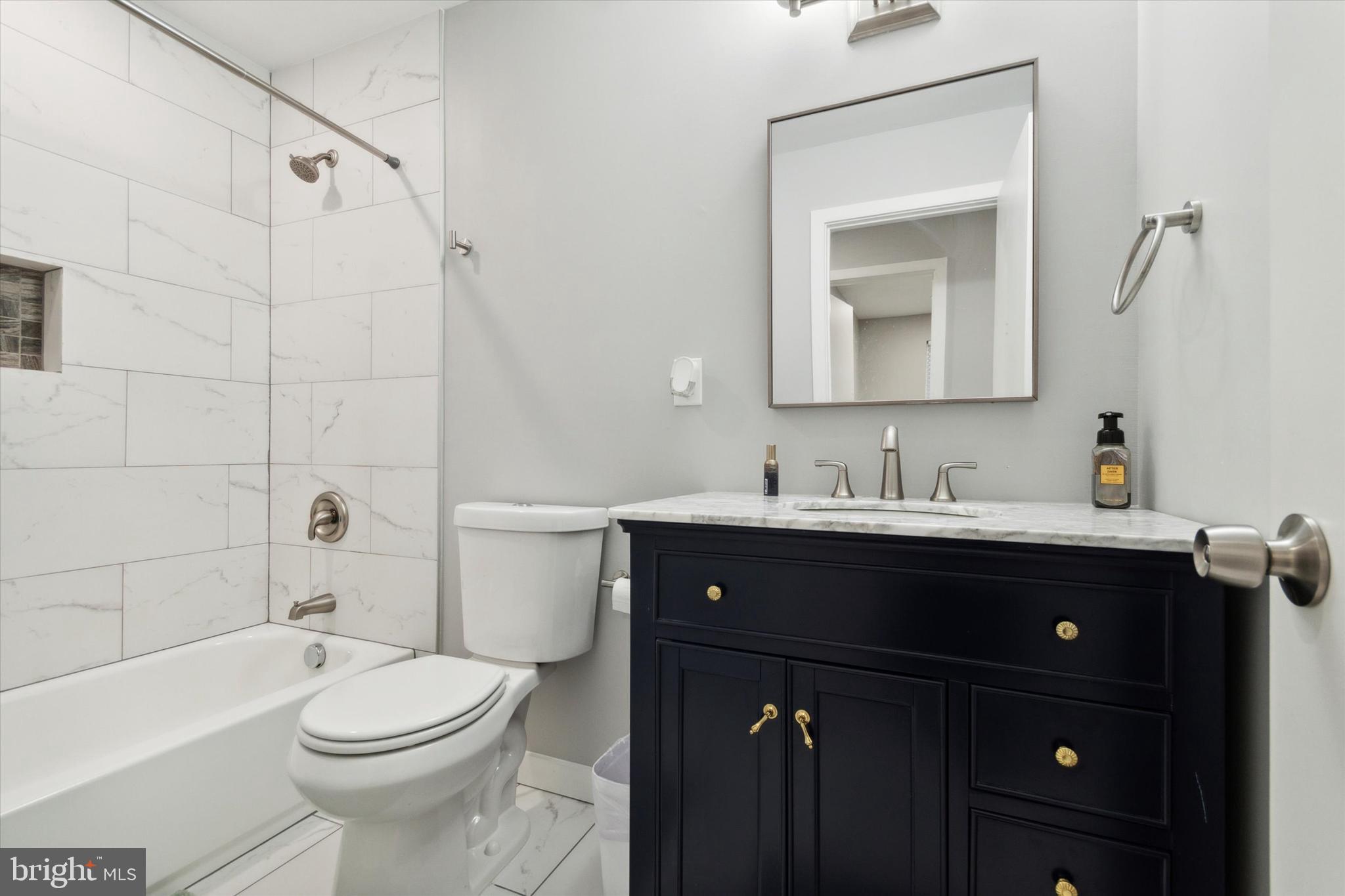 113 Kresson Gibbsboro Road, Unit 2 Voorhees, NJ 08043 - Photo 21 of 25 a bathroom with a sink a toilet and shower
